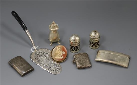 A Siamese? white metal server, a silver card case, silver vesta case a silver condiment, one other vesta case and three other items.